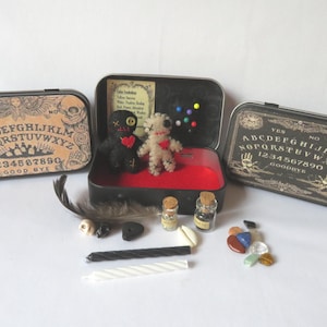 Voodoo Kit with Doll in Ouija Tin, with pins, stones, bottles, etc. A take anywhere travel set