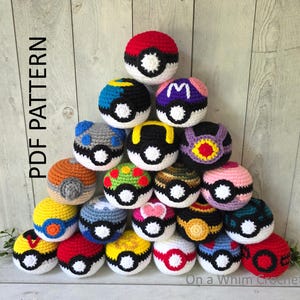 May include: A collection of fifteen spherical crochet toys arranged in a pyramid, each featuring a central white button detail. The balls display various color combinations including red, blue, yellow, pink, purple, green, and brown patterns. Text reads PDF PATTERN.