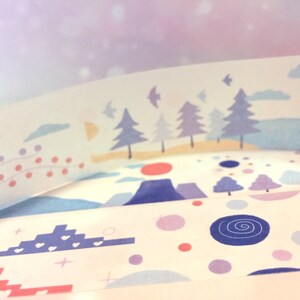 May include: Assortment of decorative washi tapes with various patterns, including a mountain range, a forest scene, and a repeating pattern of hearts and stars. The tapes are white with pastel blue, pink, and purple accents.