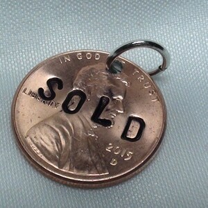 Lucky Penny Charm, penny stamped "SOLD" with ring ready to wear, lucky penny, good luck charm, jewelry supplies, real estate, coin charms,