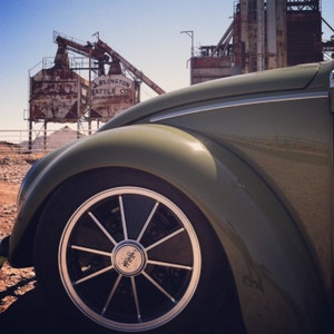 Volkswagen Beetle photograph, VW bug, old car pictures, classic car, Volkswagen, factory, German car, green car, industrial, car fender, car
