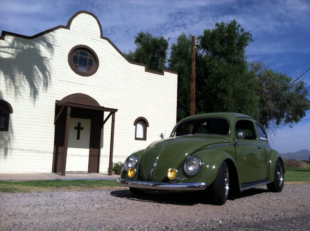 Photograph of Green Volkswagen Beetle in Front of Old Church, VW Bug ...