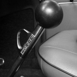 black and white Photograph of vintage HURST shifter, show car photography, old car photography, vintage cars, hot vws, hurst, drag racing