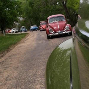 Photograph of Volkswagen's driving, VW photography, old car photography, vintage cars, hot vws, vw cruise, hot rods, vw bugs, classic cars