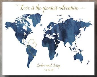 May include: A blue watercolor world map with gold accents. The map is on a white background and has a gold heart drawn over South America. The text "Love is the greatest adventure" is at the top of the map. The names "Lidia and Jerry" and the date "04.15.21" are at the bottom of the map.