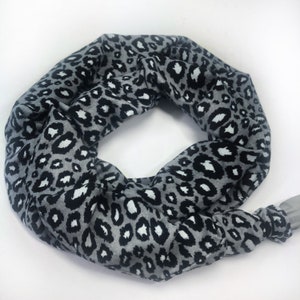 May include: A set of three ceramic mugs with a speckled, cream-colored glaze. Each mug features a different hand-painted floral design in shades of blue, green, and yellow. The mugs have a simple, rounded shape and a comfortable handle.