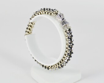 Tennis bracelet; silver metal seed beads; crystal silver night Swarovski bicones;