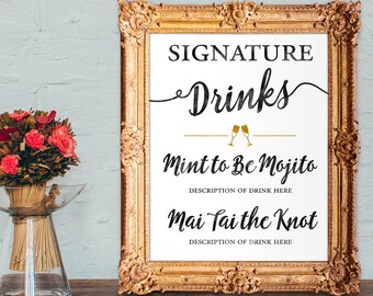 May include: A gold framed sign with white background and black text that reads "SIGNATURE Drinks Mint to Be Mojito DESCRIPTION OF DRINK HERE Mai Tai the Knot DESCRIPTION OF DRINK HERE".