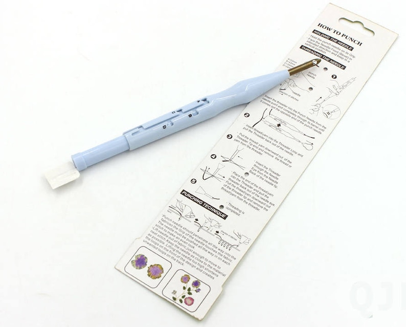 May include: A light blue plastic tool with a white handle and a gold needle. The tool is used for punching holes in fabric for crafts. The packaging includes instructions on how to use the tool.