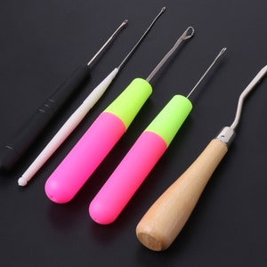 May include: Set of six crochet hooks with different colored handles. The hooks are made of metal and have a variety of sizes. The handles are made of plastic and are brightly colored.