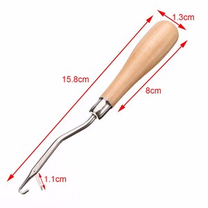 May include: A wooden handled crochet hook with a metal hook. The hook is 15.8 inches long, the handle is 8 cm long, and the hook is 1.1 cm long.
