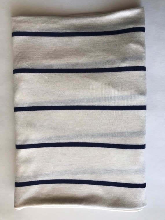 cream swaddle blanket