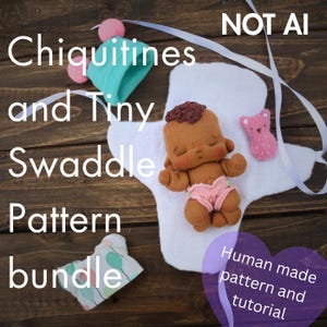 May include: A brown fabric doll with curly hair wearing pink underwear, resting on a white fabric swaddle. Includes a teal hat with pink pom-poms, a small pink bear-shaped felt piece, and a white fabric piece with a balloon print. Text reads NOT AI.
