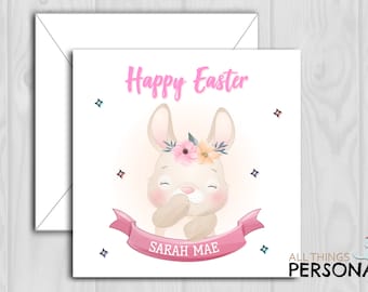 May include: A pink and white Easter card featuring a cute bunny wearing a flower crown. The card reads "Happy Easter" and "Sarah Mae".