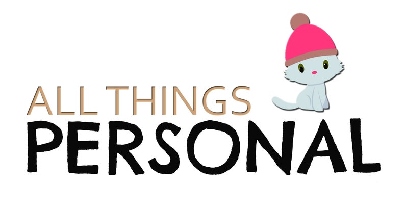 May include: A logo with the text "ALL THINGS PERSONAL" in gold and black. A cartoon cat wearing a pink hat sits to the right of the text.