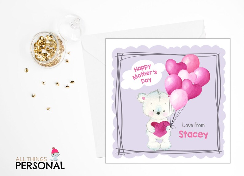 May include: A white teddy bear holding a pink heart and pink balloons with the text "Happy Mother's Day" and "Love from Stacey".