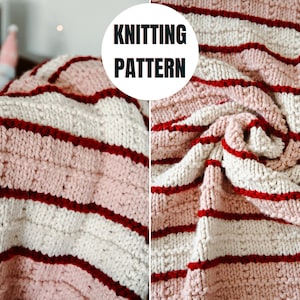 May include: A knitted blanket with alternating stripes of light pink, off-white, and dark red. The blanket has a textured appearance and is folded over. The words "KNITTING PATTERN" are in a white circle.