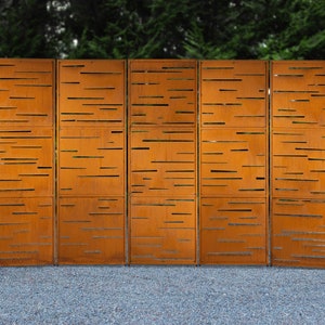 May include: A rust-colored metal privacy screen with a geometric pattern of horizontal lines. The screen is made up of six panels.