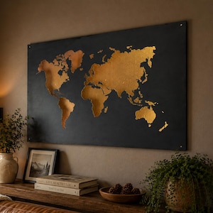 May include: A rectangular wall art piece featuring a world map with metallic gold continents set against a solid matte black background. The map displays the global landmasses in a simplified, stylized form, mounted securely to the wall surface.