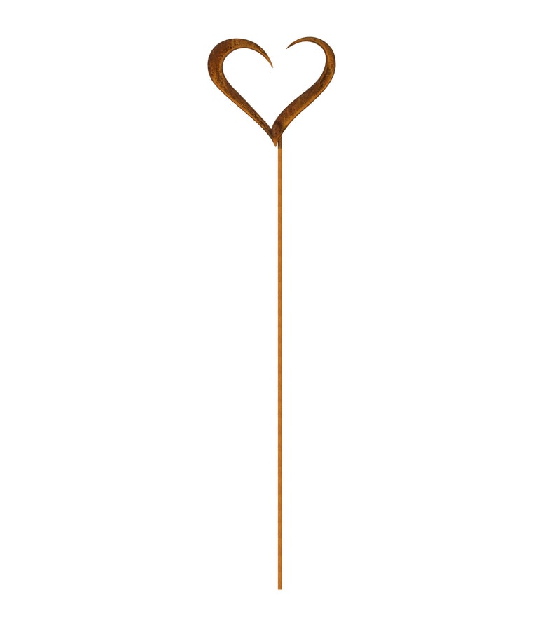 May include: A tall, slender garden stake made of rusted brown metal. The top of the stake features a stylized, open-frame heart shape with pointed ends. The metal surface has a textured, weathered patina consistent with oxidized iron or steel.
