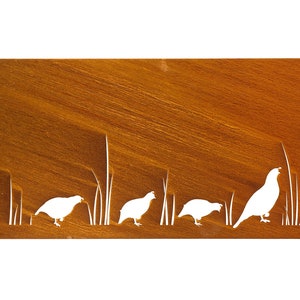 May include: A rusty metal wall art piece with a cutout design of quail birds and tall grass. The birds are white and the background is a rusty brown color.