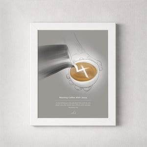May include: A framed print with the text "Morning Coffee With Jesus" and a Bible verse. The artwork depicts a hand holding a white coffee cup with a cross design in the coffee. The background is a light gray.