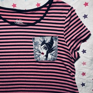 Kid’s upcycled - Maleficent pocket added to a black & pink striped tunic from Justice brand, size 12 (gently worn).