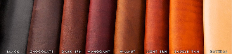 May include: Leather swatches in various shades of brown, including black, chocolate, dark brown, mahogany, walnut, light brown, saddle tan, and natural.