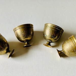 Antique Middle eastern brass inscribed chased tea cup set x 4