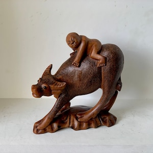 Antique Chinese wooden carved buffalo & rider statu