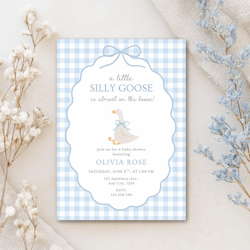 May include: Baby shower invitation with a light blue gingham pattern background. The invitation features a whimsical illustration of a goose with a blue bow. Text reads "a little SILLY GOOSE is almost on the loose!" and details for Olivia Rose's baby shower.