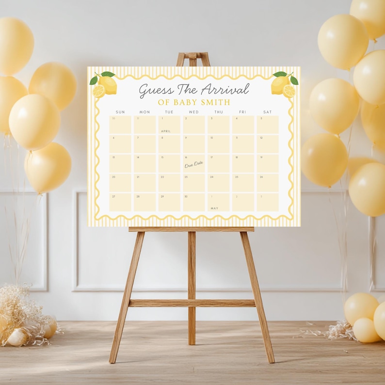 May include: A light yellow baby shower calendar on a wooden easel, with the text "Guess The Arrival of Baby Smith." The calendar has a lemon design and space for guests to guess the baby's due date. Yellow balloons are in the background.