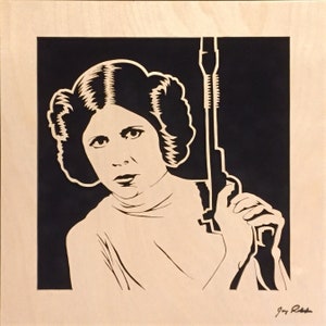 Carrie Fisher as Princess Leia Blaster at the Ready portrait is hand cut using a scroll saw and mounted to a black suede mat and framed image 4