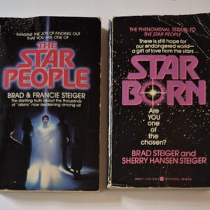 May include: Two vintage paperback books, "The Star People" and "Star Born", with dark covers and vibrant text. The first book features a red title and a central image of a figure in a bright light. The second book has a pink title and a starry background.