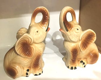 Vintage Pair Of Brown & Beige Ceramic Raised Trunk Elephant Figurines. Made In Brazil