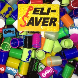 May include: A collection of colorful cylindrical objects, including blue, green, yellow, and pink, with a logo and the text "PELI-SAVER" on a yellow and orange background. The objects are scattered, showing various colors and designs.