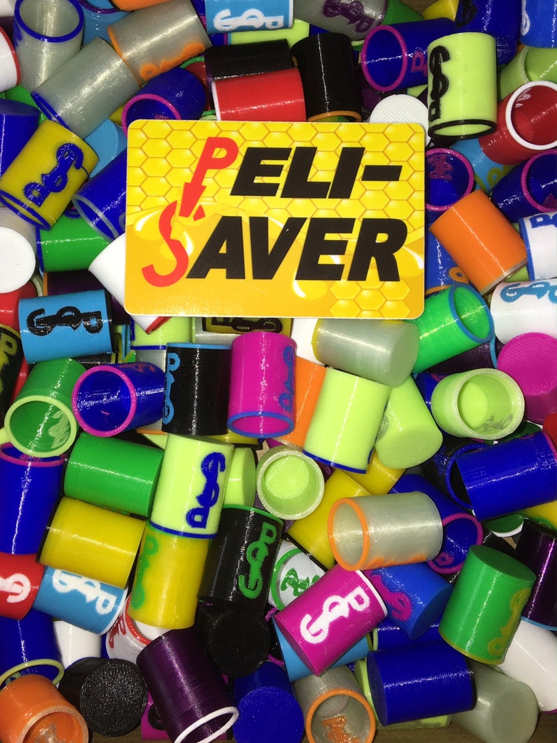 May include: A collection of colorful cylindrical objects, including blue, green, yellow, and pink, with a logo and the text "PELI-SAVER" on a yellow and orange background. The objects are scattered, showing various colors and designs.