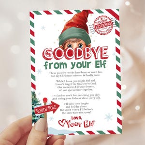 May include: A Christmas-themed card with the text "Goodbye from your Elf." The card features an illustration of an elf wearing a red hat and green outfit. The card has a red and green border and includes a message.