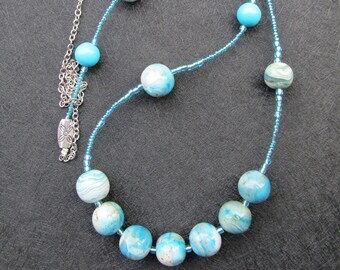 Long necklace in polymer clay, made with 16 round beads