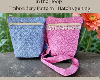 May include: Two quilted bags, one blue and one pink, with a zipper closure and a matching strap. The bags are made with a hatch quilting pattern. The text "In the Hoop Embroidery Pattern - Hatch Quilting" is at the top of the image. The text "Digital Download - Make the bag 2 ways - Hatch Quilting" is at the bottom of the image.