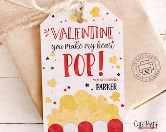 May include: Printable Valentine's Day gift tag featuring a red and white popcorn bucket with the text "Valentine you make my heart POP!" and "Your friend, Parker".
