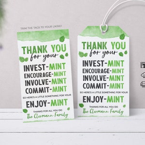 May include: Two green and white gift tags with a watercolour background. The tags have the text "Thank you for your" and a list of words with "mint" at the end of each word. The text "The Clermann Family" is at the bottom of each tag.