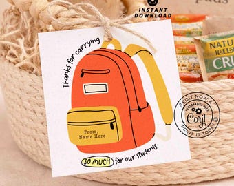 May include: A woven basket filled with a glass tumbler, snacks, and a tag. The tag features an orange backpack illustration with the text "Thanks for carrying...so much for our students." A glass tumbler with a wooden lid and straw is visible.