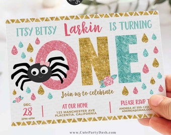 May include: A pink and teal glitter "One" with a black spider and gold glitter raindrops. The text "Itsy Bitsy Larkin is Turning" is at the top of the card. The text "Join us to celebrate" is below the number one. The text "At our home" is below that. The text "123 Manchester Ave Placentia, California" is below that. The text "Please RSVP" is on the right side of the card. The text "Andrea at 555-1234" is below that. The text "Andreasgmail.com" is below that. The text "Dec 28 2PM-4PM" is on the left side of the card. The text "www.CutePartyDash.com" is at the bottom of the card.