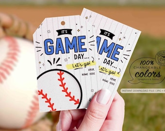 May include: Two printable baseball game day tags with a baseball graphic and the text "It's Game Day... Let's go!"  The tags are white with blue and yellow accents. 100% Changeable Colors (graphics & fonts). Instant Download File | JPG + PDF