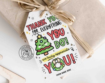 May include: A gift tag on a brown paper-wrapped present tied with raffia. The tag reads "THANK YOU FOR EVERYTHING YOU DO!" with a cartoon Christmas tree and wreath. It also includes "we truly appreciate YOU!" and "FROM NAME HERE".