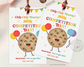 May include: Two printable tags featuring a cartoon chocolate chip cookie with a happy face holding up cheerleading pom-poms. The text on the tags reads "Chip Chip Hooray! It's Competition Day!" and "Good luck! You've got this! Your name here."