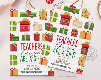 May include: Red and green gift tag with a white background and a lined pattern. The tag says "Teachers like you are a gift! Merry Christmas" and has space for a name or company.