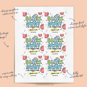 May include: Six printable volleyball-themed gift tags with the text "Blow Away the Competition" and "Good Luck!" in a colorful, hand-drawn style. The tags are designed for easy cutting and feature customizable text.
