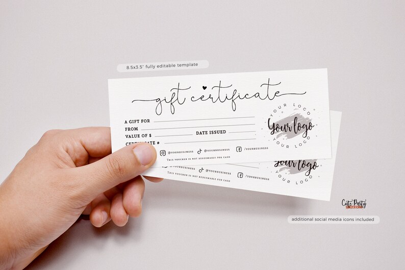 May include: A white gift certificate template with a black handwritten font. The text reads "gift certificate". The template includes fields for "A gift for", "From", "Value of $", "Date Issued", and social media icons. The template also includes a logo with the text "Your logo" in a circle with a gray watercolor brush stroke.